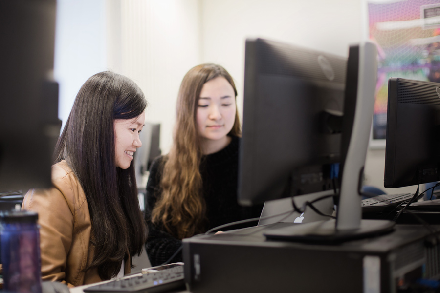 Two female students sitting at a computer