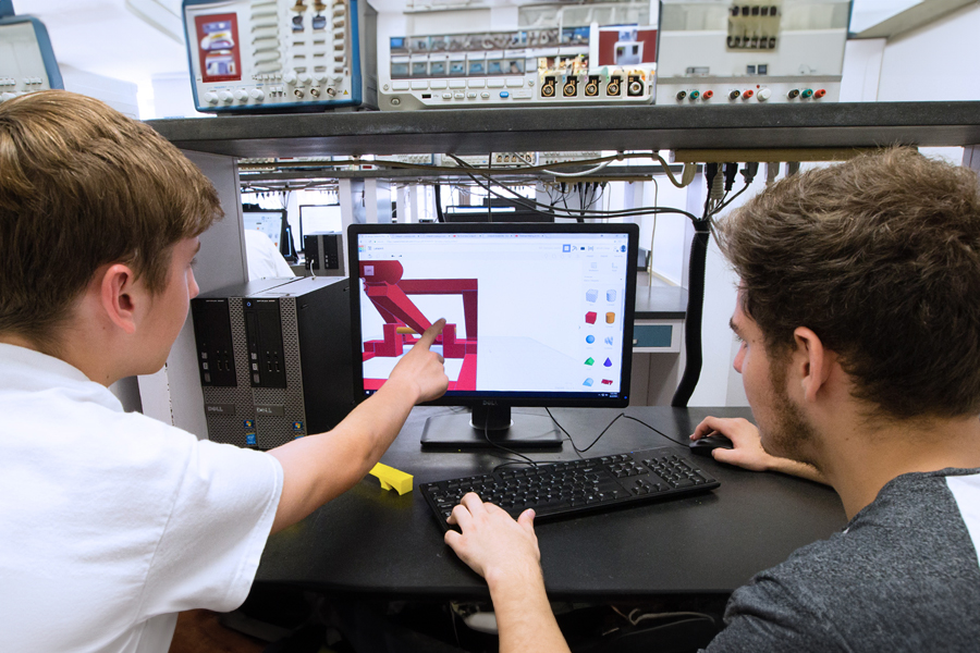 Two students in computer lab.