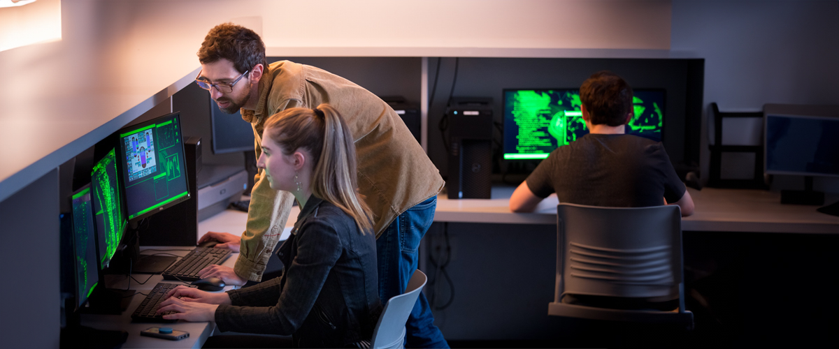 People on computers in a computer lab.