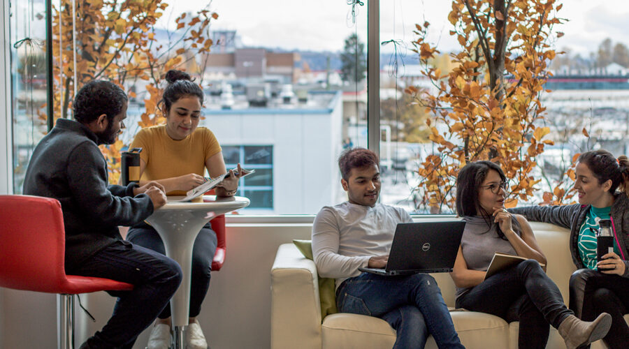 Students hanging out on a couch at the Vancouver campus.